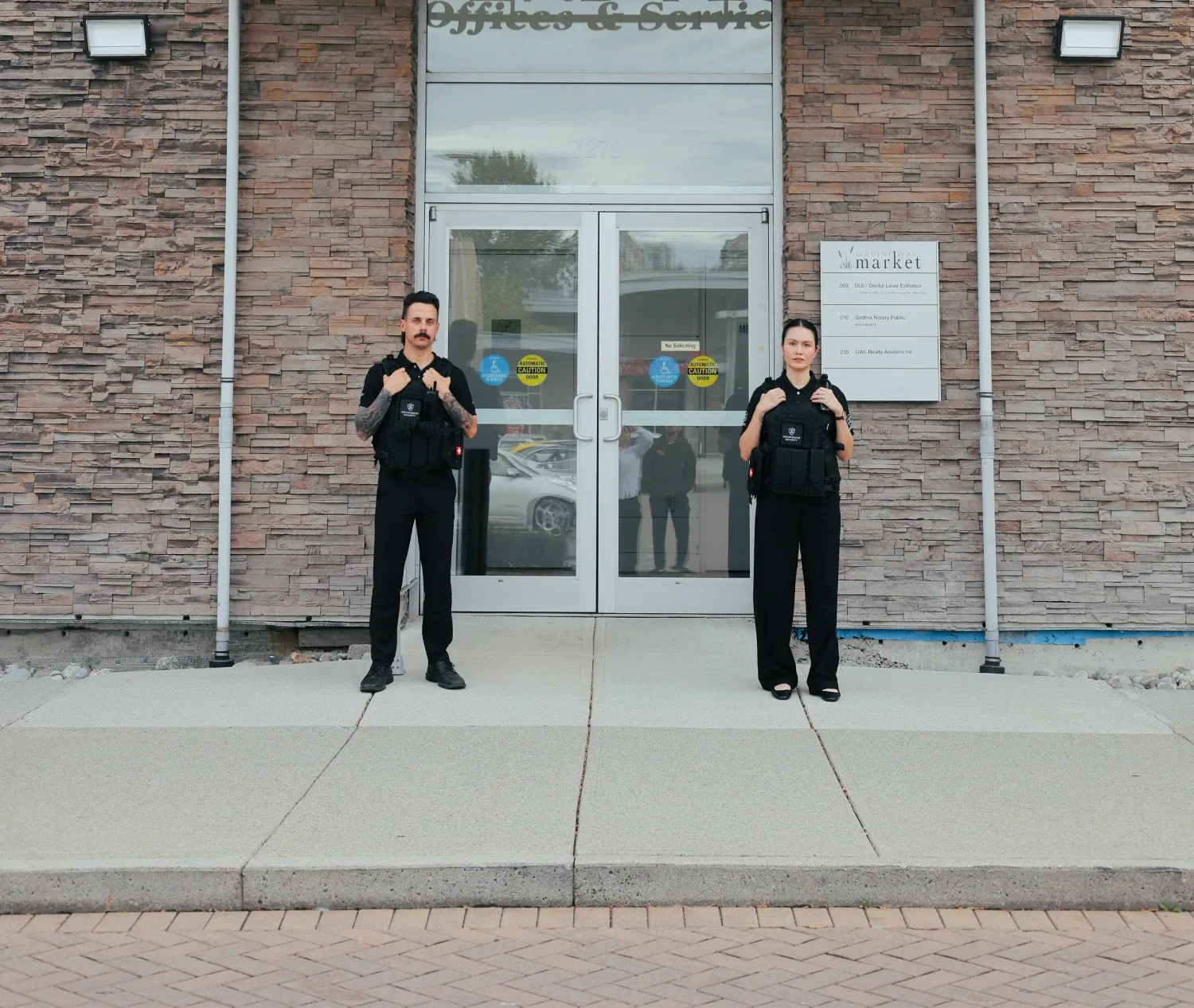 Securisquad office security guard monitoring a commercial building lobby